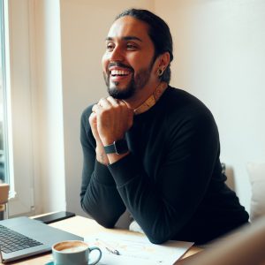 Business, laptop and man with smile, thinking or planning for digital marketing, consultant or corp