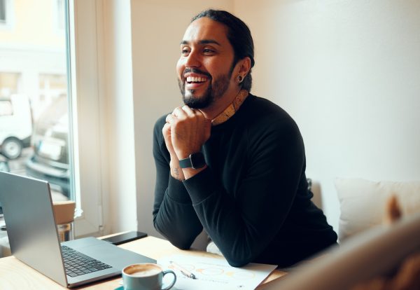 Business, laptop and man with smile, thinking or planning for digital marketing, consultant or corp