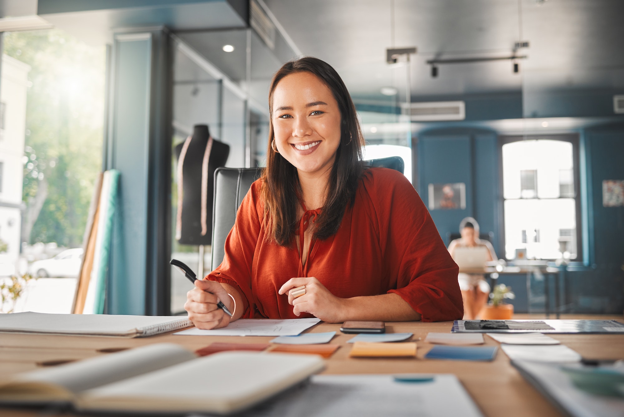 Thinking up new designs. Shot of a young businesswoman working in an office.
