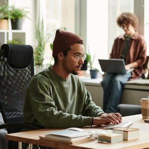 Young serious webdesigner working over new website