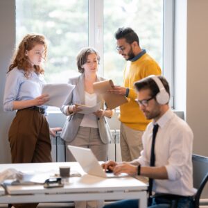 Content pensive young multi-ethnic colleagues